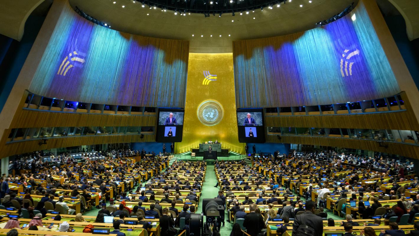 A wide view of the General Assembly Hall as Secretary-General António Guterres (at podium and on screens) addresses the opening of the Summit of the Future.