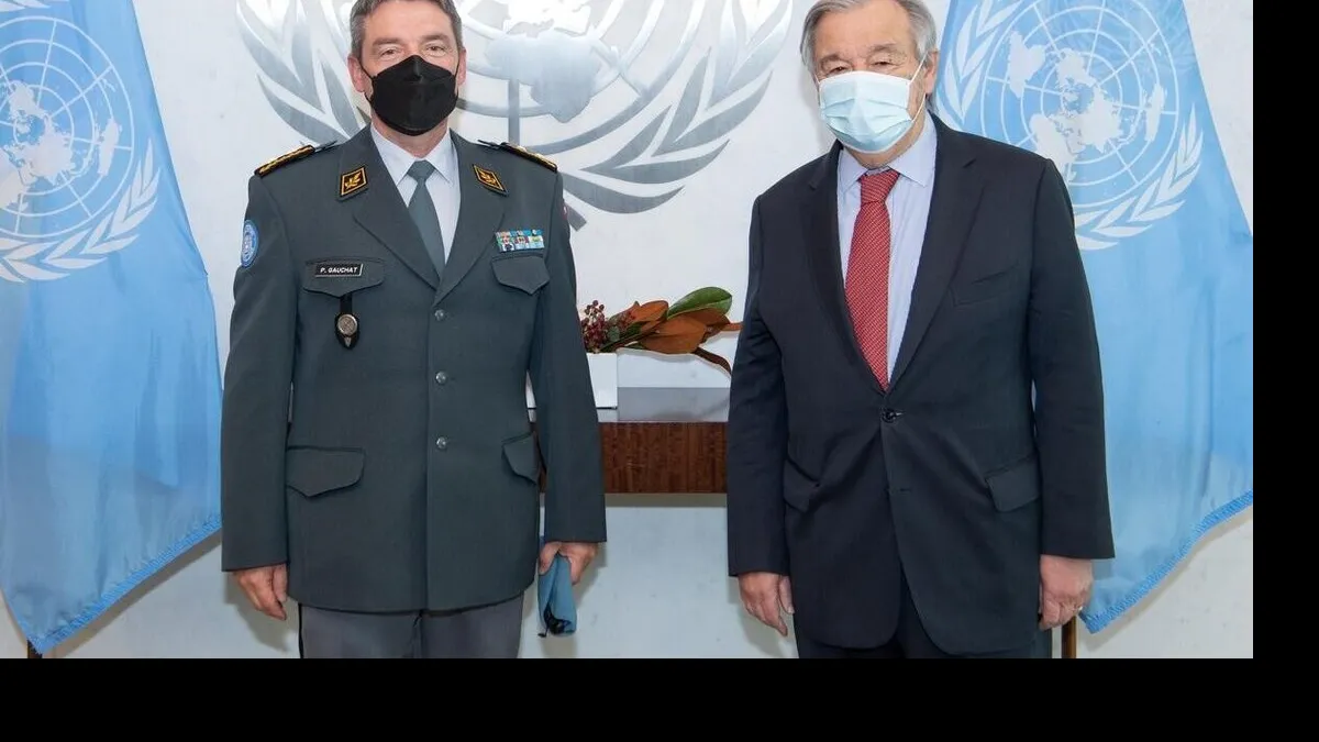 UN Secretary General Guterres stands next to Major General Gauchat
